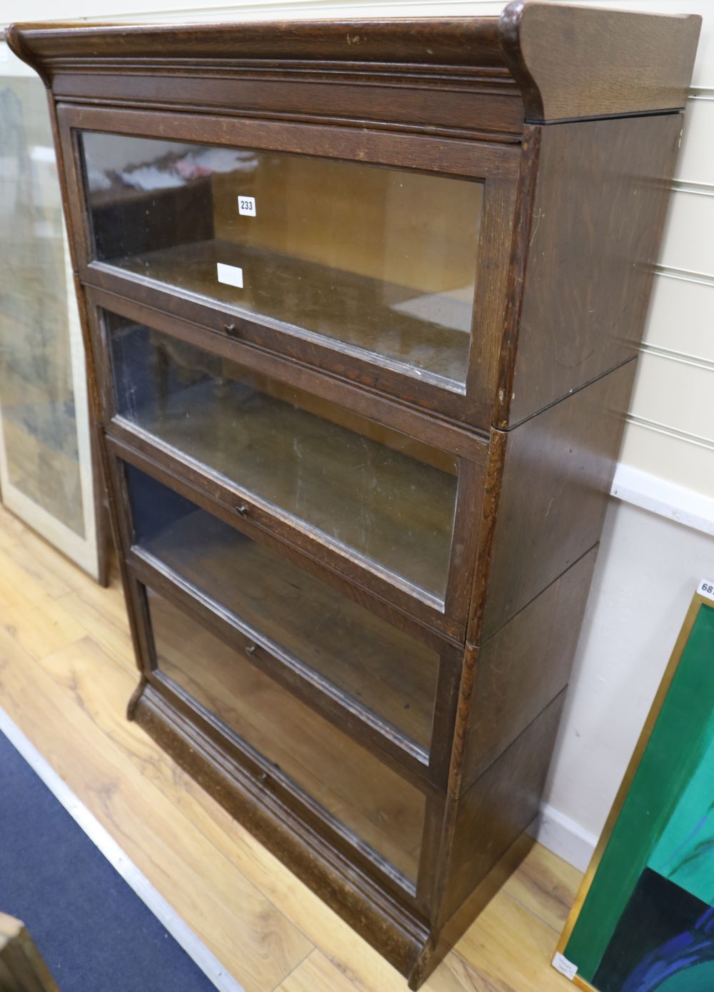 An early 20th century oak Globe Wernicke-style oak four section bookcase, width 87cm depth 36cm height 140cm